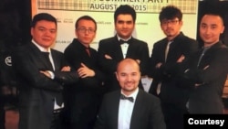 Kasim Kashgar, center front, is photographed with, from right, Semet Ababekri, Abdukadir Rozi, Akber Osman, Mirkamil Ahmed and Mehmut Abdukeyum, during a school party in Urumqi in August 2015. (Photo courtesy of Kasim Kashgar)
