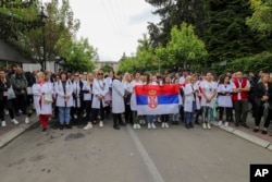 FILE - People attend a protest rally in front of the city hall in the town of Zvecan, Kosovo, May 31, 2023. Hundreds of ethnic Serbs began gathering in front of the city hall in repeated efforts to take over the offices where ethnic Albanian mayors took up their posts last week.