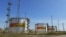 FILE - Fuel tanks are seen at a facility owned by Russia's Rosneft energy company outside the town of Neftegorsk in the Samara region, Russia, Sept. 1, 2023.