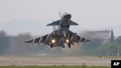 FILE - In this photo released by Xinhua News Agency, a Chinese People's Liberation Army fighter jet takes off from Nanjing, in eastern China, April 8, 2023, during combat readiness patrol and military exercises around the self-ruled island of Taiwan.