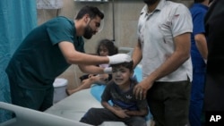 A Palestinian boy wounded in Israeli bombardment on Gaza Stripcries in a hospital in Deir al-Balah, south of the Gaza Strip, Oct. 21, 2023.