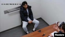 FILE — Xiaolei Wu sits in an FBI office in Chelsea, Massachusetts, Dec. 14, 2022. He has been convicted of stalking and harassing a Chinese classmate for posting flyers supporting democracy in China. (U.S. Attorney’s Office for the District of Massachusetts/Handout via Reuters)