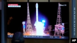 A TV screen shows a report of North Korea launching a satellite into orbit, during a news program at the Seoul Railway Station, in Seoul, South Korea, Nov. 22, 2023.