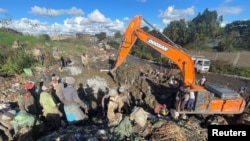 Scavengers sort recyclable plastic waste materials at the Dandora dumping site on the outskirts of Nairobi, Kenya, Nov. 16, 2023.