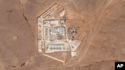 FILE - This satellite photo from Planet Labs PBC shows a military base known as Tower 22 in northeastern Jordan, Oct. 12, 2023. 