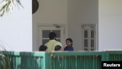 Indian wrestler Sakshi Malik stands outside the residence of India's Sports Minister Anurag Thakur for a meeting to demand the arrest of the Wrestling Federation of India chief, accused of sexually harassing female wrestlers, in New Delhi, June 7, 2023.
