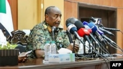 FILE - This handout image posted on the Sudanese Armed Forces's Facebook page on Aug. 24, 2024, shows Gen. Abdel Fattah al-Burhan giving a press conference in Port Sudan, in the Red Sea state.