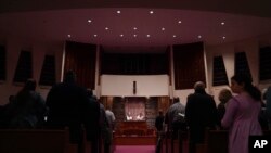 Rabbi Daniel Fellman, left, and Cantor David Reinwald, right, lead Shabbat service, Oct. 13, 2023, at Temple Sinai in Pittsburgh, Pennsylvania.