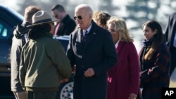 U.S. President Joe Biden and first lady Jill Biden greet people at they arrive near Valley Forge, Pennsylvania, Jan. 5, 2024. 