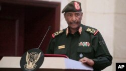 FILE - Sudan's Army chief Gen. Abdel-Fattah Burhan speaks in Khartoum, Sudan, Dec. 5, 2022. Burhan planned face-to-face meeting with Gen. Mohammed Hamdan Dagalo was postponed, the country's foreign ministry announced on Dec. 27, 2023.