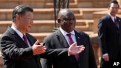 FILE - South Africa's President Cyril Ramaphosa, right, with Chinese President Xi Jinping during a state visit at Union Building in Pretoria, South Africa, Aug. 22, 2023. 