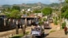 FILE - Army officers stand guard as police officers patrol in Lashio, Myanmar, on May 29, 2013. The country's military regime lost Lashio, the location of its northeast regional command center, on Aug. 3, 2024, to armed resistance groups.