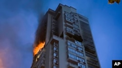 A multi-story apartment building is damaged during Russian attack in Kyiv, Ukraine, June 24, 2023.