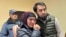 Uzbek blogger Olimjon Haydarov, right, puts his arm around his mother after the verdict in a Ferghana criminal court, Uzbekistan, Dec. 1, 2023.