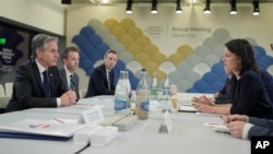 U.S. Secretary of State Antony Blinken, left, talks to German Foreign Minister Annalena Baerbock during their bilateral meeting at the Annual Meeting of World Economic Forum in Davos, Switzerland, Jan. 16, 2024.