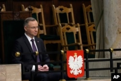 Poland's President Andrzej Duda attends the first session of the lower house, or Sejm, of the newly-elected parliament in Warsaw, Poland, Nov. 13, 2023.
