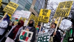 FILE - Protesters gather at Foggy Bottom Metro in Washington, Nov. 24, 2023, in support of Palestinians and to call for a permanent ceasefire in Gaza.
