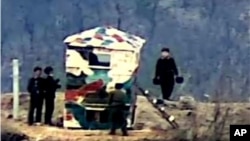 In this undated photo provided and released on Nov. 27, 2023, by South Korea Defense Ministry, North Korean soldiers install their guard post in the Demilitarized Zone in North Korea.