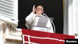 Pope Francis leads the Angelus prayer from his window, at the Vatican, Jan. 1, 2024. (Vatican Media/Handout via Reuters)