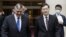 Russia's deputy foreign minister Andrey Rudenko, left, and China's Foreign Minister Qin Gang walk together as they meet in Beijing, June 25, 2023.