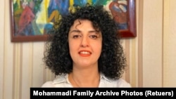 FILE - Iranian human rights activist and 2023 Nobel Peach Prize winner tNarges Mohammadi poses in this undated handout picture. 