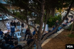 Hundreds of men are being housed at this municipal building in Ramallah, the West Bank, after they were trapped outside of Gaza when the Israel-Hamas war began, pictured Oct. 13, 2023. (Yan Boechat/VOA)
