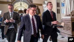 Speaker of the House Mike Johnson leaves the chamber just after the House approved a nearly $14.5 billion military aid package for Israel, but without humanitarian assistance for Gaza, at the Capitol in Washington, Nov. 3, 2023. 