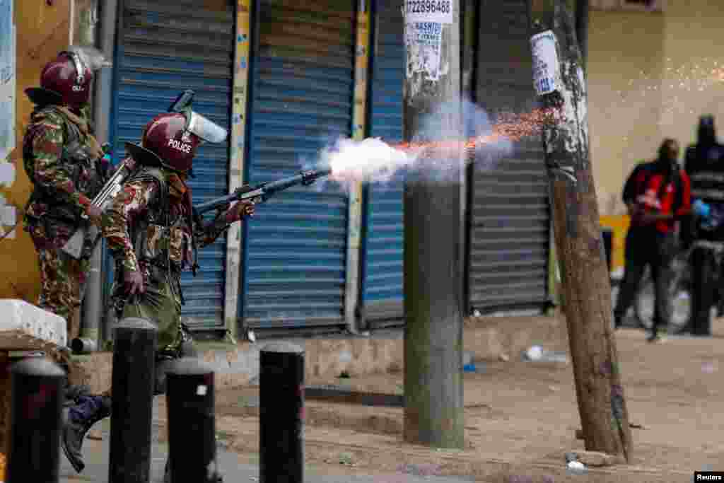A police officer fires tear gas towards pro-reform protesters during an anti-government demonstration over what organizers say are tax hikes, bad governance, constitutional violations, extra-judicial killings and cost of living, in Nairobi, Kenya.