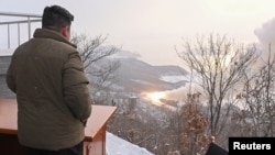 North Korean leader leader Kim Jong Un guides a rocket motor test at the Sohae Satellite Launching Ground in Tongchang-ri, North Korea, Dec. 15, 2022, in this photo released by North Korea's Korean Central News Agency.