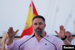 FILE - Spain's far-right Vox party leader Santiago Abascal gestures as he speaks during an opening campaign rally ahead of the July 23 snap election, in Puerto Almerimar, El Ejido, Spain, July 6, 2023.
