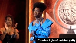 J. Harrison Ghee accepts the award for best performance by an actor in a leading role in a musical for "Some Like It Hot" at the 76th annual Tony Awards on June 11, 2023, at the United Palace theater in New York. (Charles Sykes/Invision/AP)