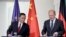 German Chancellor Olaf Scholz, right, and Chinese Premier Li Qiang, brief the media following government consultations of the both countries at the chancellery in Berlin, Germany, Tuesday, June 20, 2023.