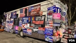 A merchandise bus, selling all sorts of Trump memorabilia, was parked next to the hotel where Donald Trump gave his New Hampshire primary night speech, Jan. 23, 2024. (Carolyn Presutti/VOA)