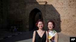 FILE - Chinese tourists pose for a photo outside a tourist attraction in Rabat, Morocco, on Aug. 17, 2018. African nations are pushing to attract visitors from China after the travel restrictions of the COVID-19 pandemic.