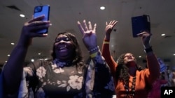 Audience members chant "Four more years" as President Joe Biden speaks at South Carolina's First in the Nation dinner at the South Carolina State Fairgrounds in Columbia, S.C., Jan. 27, 2024. 