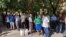 A large crowd of Uzbek journalists and activists wait outside Mirabad Disctrict Criminal Court in Tashkent, Uzbekistan, to observe the trial of blogger Abduqodir Muminov, July 25, 2023. (Farukh Samarqandiy/VOA Trainee) 
