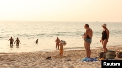 FILE - Russian tourists stay at the beach in Phuket, Thailand, March 12, 2022.