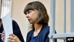 FILE - Ksenia Fadeyeva, a former local deputy in the Siberian city of Tomsk and ally of jailed Russian opposition leader Alexey Navalny, looks on as she attends a court hearing in Tomsk, Russia, Aug. 14, 2023.
