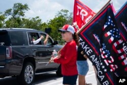 Supporters of former President Donald Trump gather outside Mar-a-Lago, in Palm Beach, Florida, June 11, 2023.