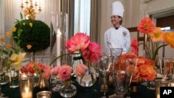 Flower centerpieces are seen during a media preview, June 21, 2023, at the White House, ahead of Thursday evening's State Dinner with India.