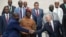 Russian President Vladimir Putin, right, and Mozambique President Filipe Nyusi shake hands during a photo shoot at the Russia Africa Summit in St. Petersburg, Russia, July 28, 2023.