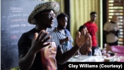 Chef Serigne Mbaye speaks to the crowd at the Afro Freedom/Afro Feast Juneteenth celebration at Grow Dat Youth Farm in New Orleans on June 19, 2023. Mbaye works to spotlight African-influenced cuisine at his New Orleans restaurant Dakar NOLA.
