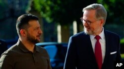 Czech Republic's Prime Minister Petr Fiala, right, welcomes Ukrainian President Volodymyr Zelenskyy in Prague, Czech Republic, July 7, 2023.