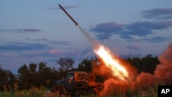 A Ukrainian army Grad multiple rocket launcher fires rockets at Russian positions at a front line near Bakhmut, Donetsk region, Ukraine, July 12, 2023.