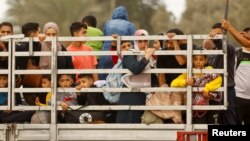 Palestinians flee north Gaza to move southward, as Israeli tanks roll deeper into the enclave, amid the ongoing conflict between Israel and Hamas, in the central Gaza Strip, Nov. 12, 2023.
