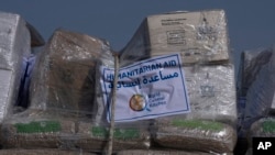 FILE - Aid bound for the Gaza Strip is seen on a truck at Kerem Shalom Crossing on the intersection of two borders: between Egypt and Israel and the Gaza Strip and Israel, Jan. 10, 2024. The U.S. military has been ordered to build a port in Gaza to assist in delivering aid.
