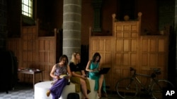 Confessional booths are stacked into a corner at the Sacred Heart church in Mechelen, Beligum, June 19, 2023.