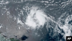 This GeoColor satellite image taken June 20, 2023, and provided by NOAA, shows Tropical Storm Bret as it chugged toward the eastern Caribbean.