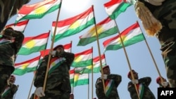 FILE — Iraqi-Kurdish Peshmerga officers in Irbil, the capital of Iraq's northern autonomous Kurdish region. Officials confirmed that two "suicide drone" attacks by suspected Iran-backed Shiite militants late Saturday hit the key headquarters of Peshmerga forces in Irbil. 