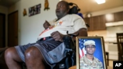 A portrait of American soldier Travis King is displayed as his grandfather, Carl Gates, talks about his grandson July 19, 2023, in Kenosha, Wis.